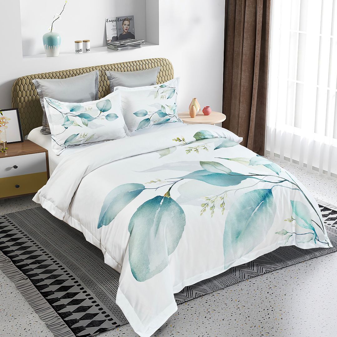 Angelis Leaves Quilt Cover Set - Super King Size with teal leaf design on white bedding in modern bedroom setting