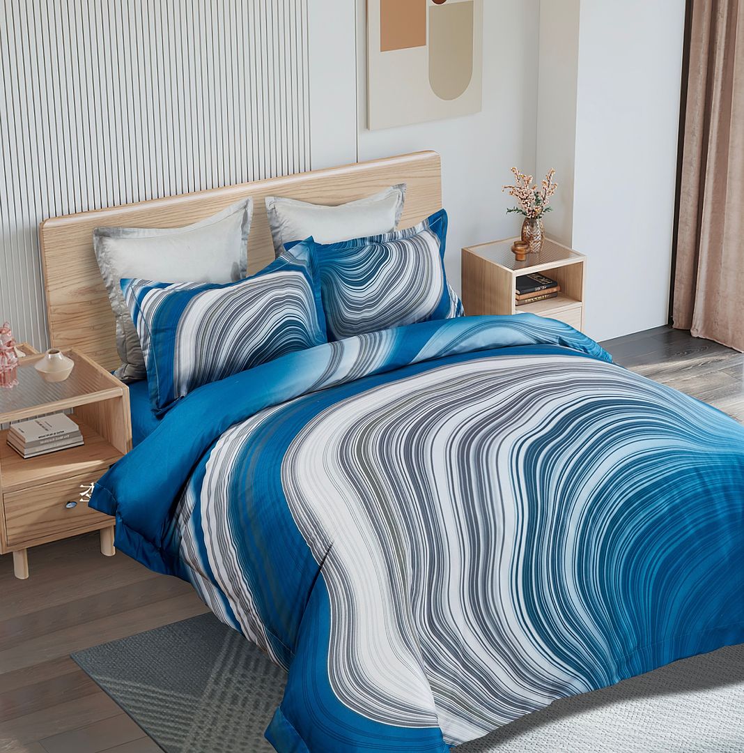 Evienne Quilt Cover Set - Super King Size in blue and gray swirl pattern on bed in modern bedroom setting