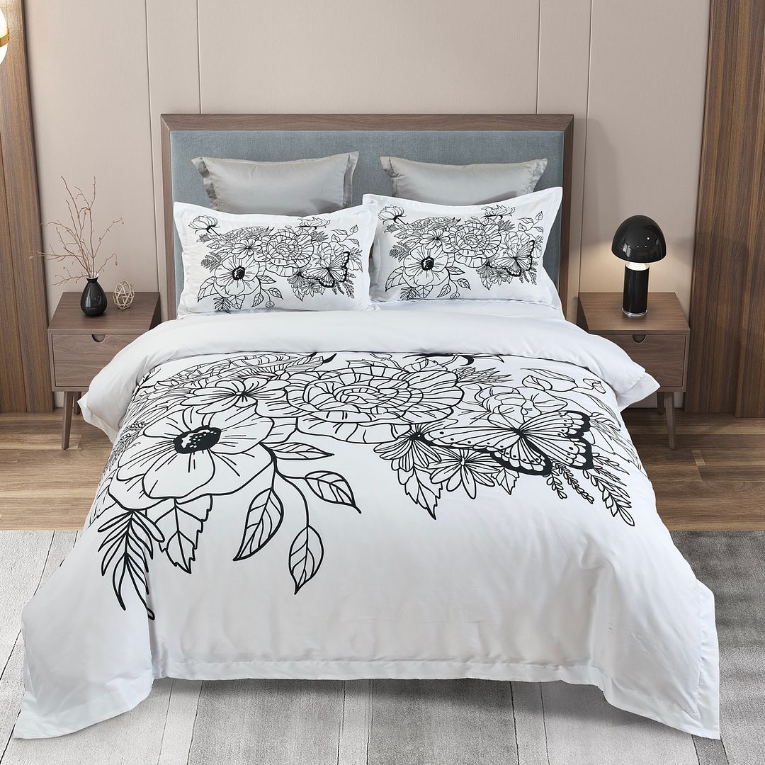 Viene Floral Quilt Cover Set - Super King Size with black and white floral design on bed in modern bedroom setting