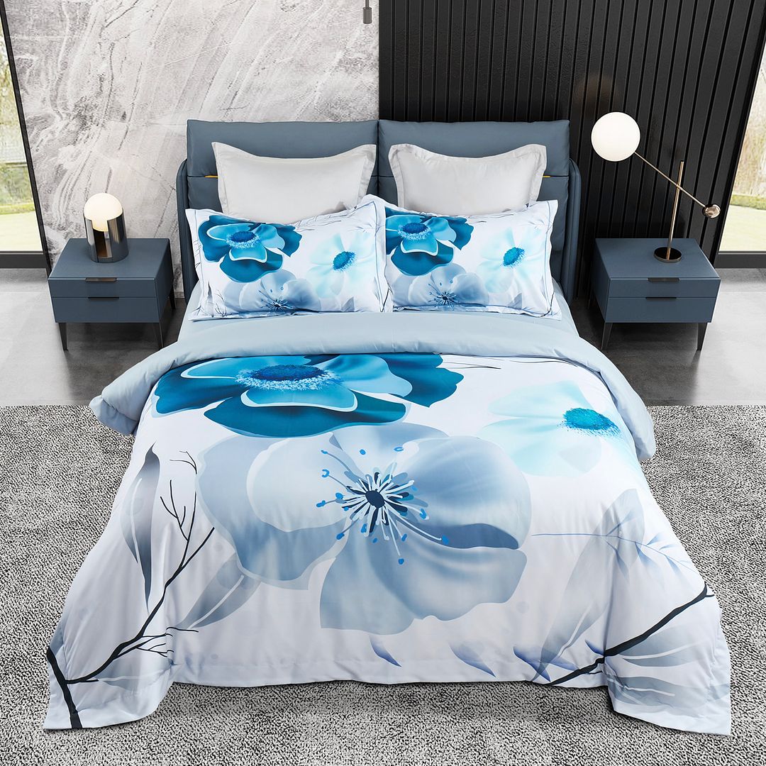 Julieta Floral Quilt Cover Set - Super King Size with large blue floral pattern on bed with blue bedside tables and lamps
