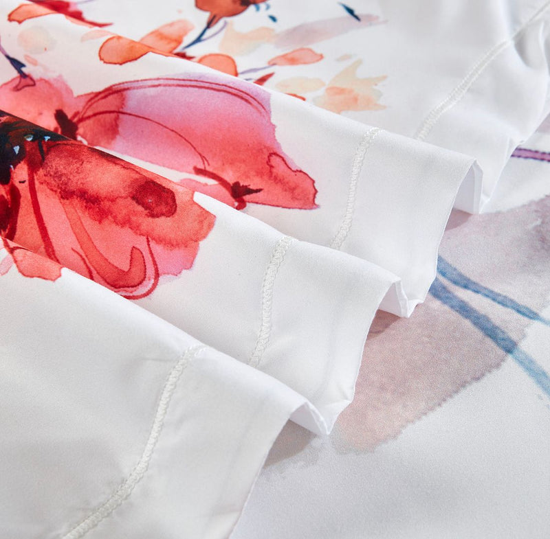 Close-up of floral print and stitching detail on the Lulani Floral Quilt Cover Set - Super King Size bedding by Bedzy