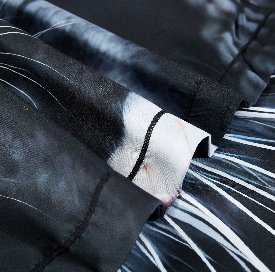 Close-up of black and white fabric details on Cat Quilt Cover Set - Super King Size by Bedzy.