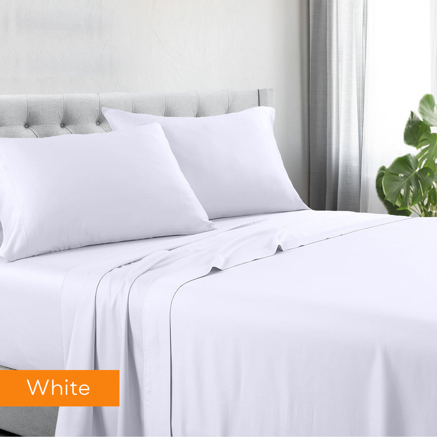 1200tc hotel quality cotton rich sheet set double white on bed with gray tufted headboard and natural light