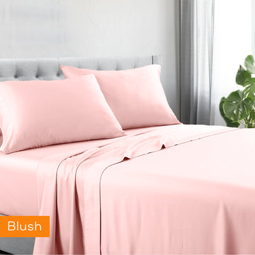 1200tc hotel quality cotton rich sheet set king single blush on a bed with matching pillowcases in a bright bedroom setting