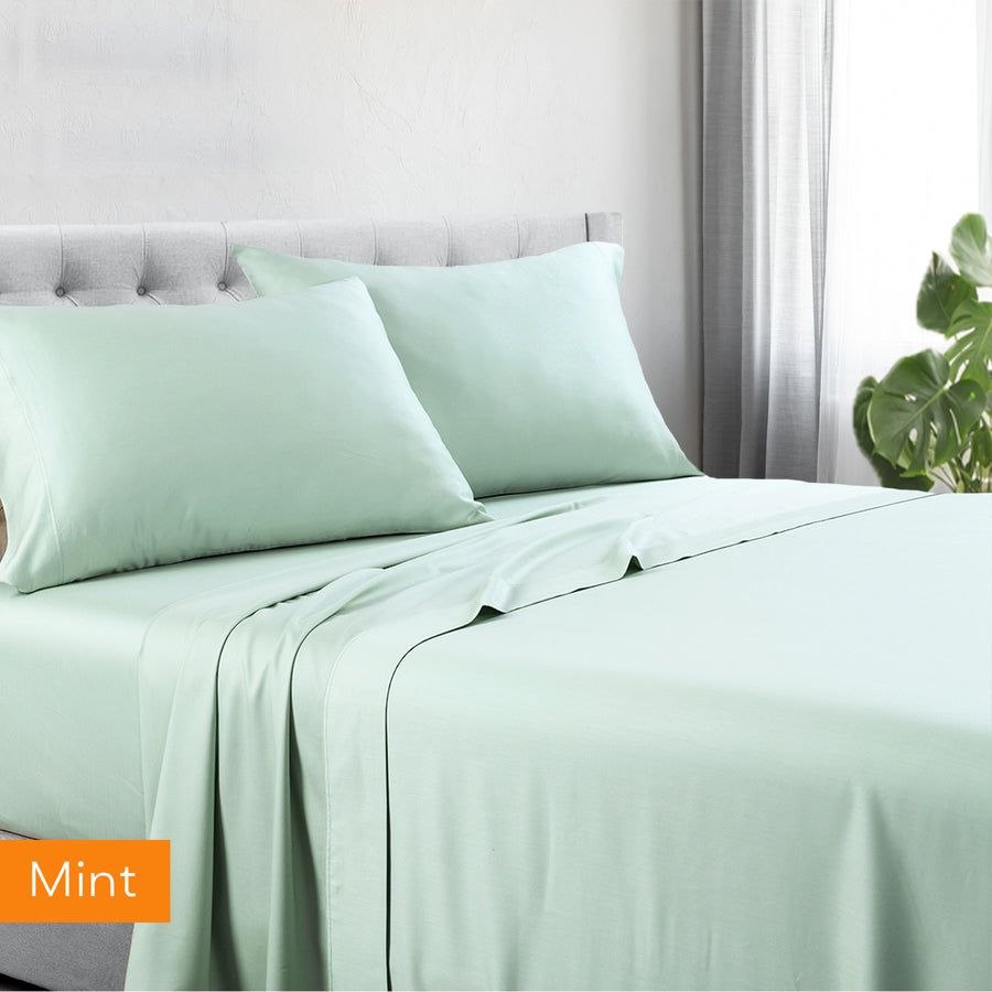 1200tc hotel quality cotton rich sheet set king single mint on bed with tufted headboard and natural light