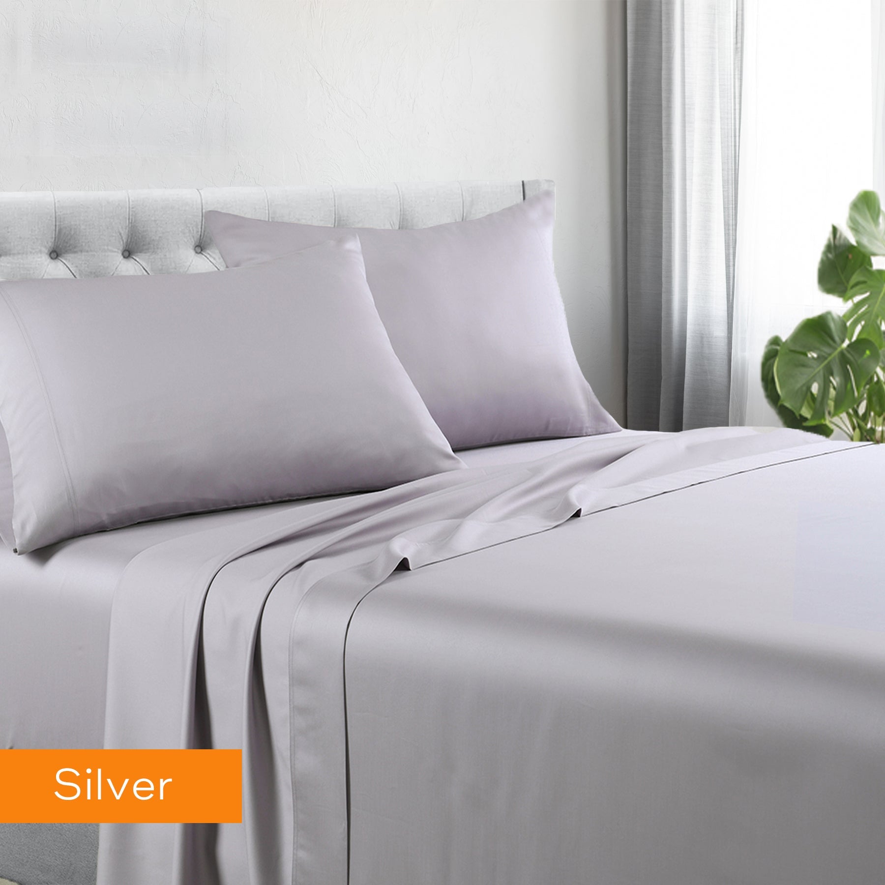1200tc hotel quality cotton rich sheet set king single silver on bed with tufted headboard and natural light background