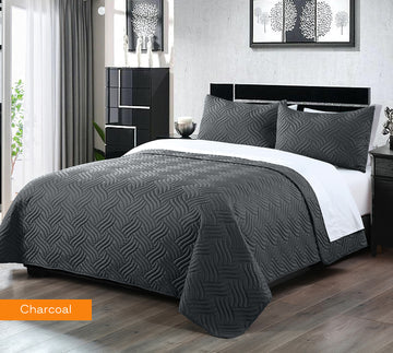 3 piece embossed comforter set king charcoal on bed with matching pillowcases in modern bedroom setting