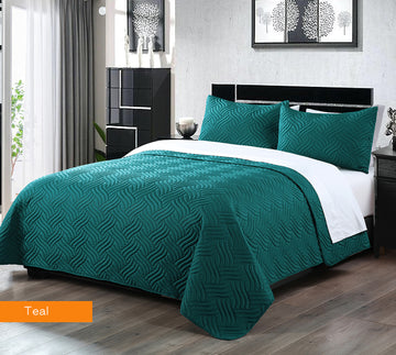 3 piece embossed comforter set king teal on bed with matching pillowcases in modern bedroom setting