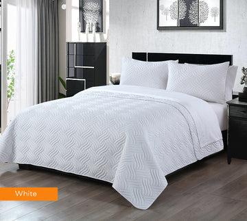 3 piece embossed comforter set king white on modern bed with pillows in contemporary bedroom setting