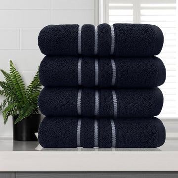 amor classic dobby stripe super soft premium cotton hand towel 4 pcs sailor blue stacked on white countertop with plant