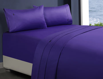 1000tc egyptian cotton 1 fitted sheet and 2 pillowcases double violet set on bed in bedroom setting by window