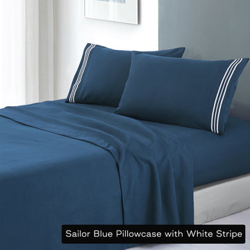 Soft microfibre embroidered stripe sheet set king single sailor blue pillowcase white stripe on bed with white frame
