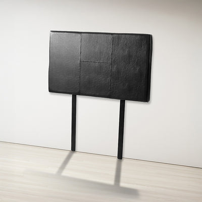 Single Size | Bed Headboard (Black) with stitched panel design, black upholstery, standing against white wall in bedroom furniture setup