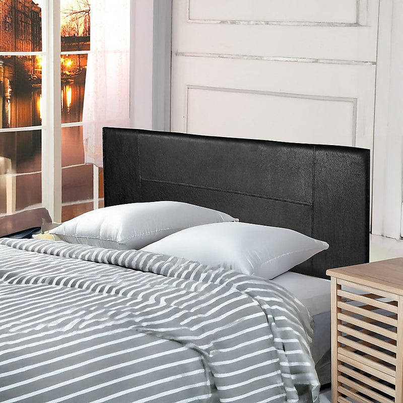 Double Size | PU Leather Bed Headboard Bedhead (Black) with designer stitching in a cozy bedroom setting
