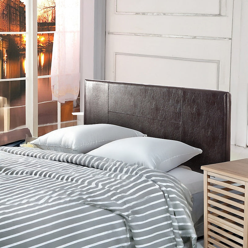 Double Size | PU Leather Bed Headboard Bedhead (Brown) in bedroom setting with striped bedding and bedside table.