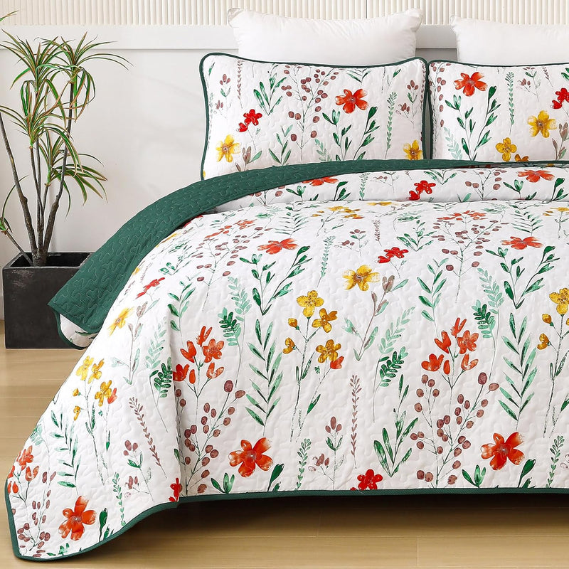 Enchanting Fields Cozy 3 Pc Bedspread & Pillow Cover Set with floral pattern and green edging on a queen bed in bedroom setting