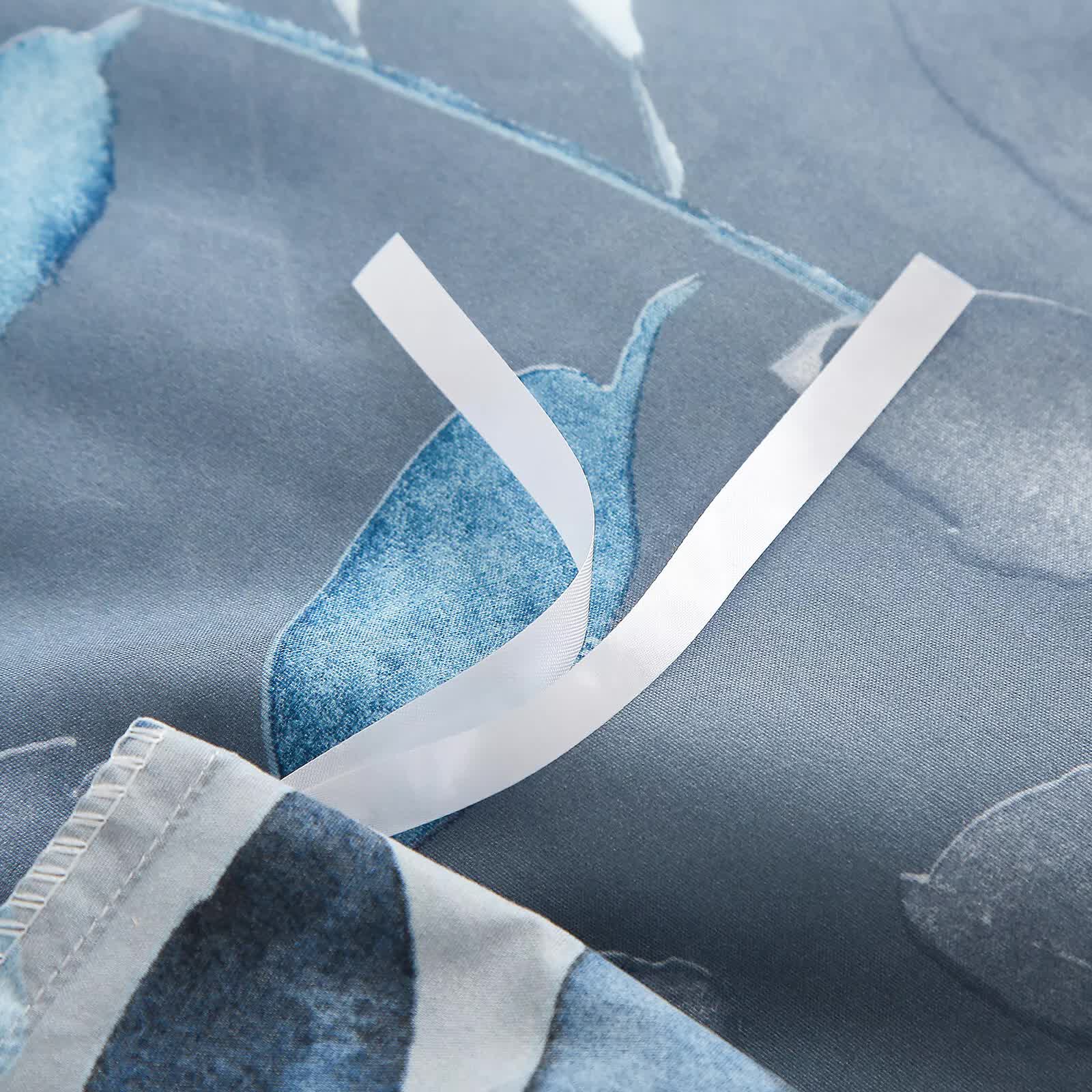 Close-up of fabric ties on the Timeless Design Plaid Duvet Cover Set - Lightweight-King with blue and gray pattern