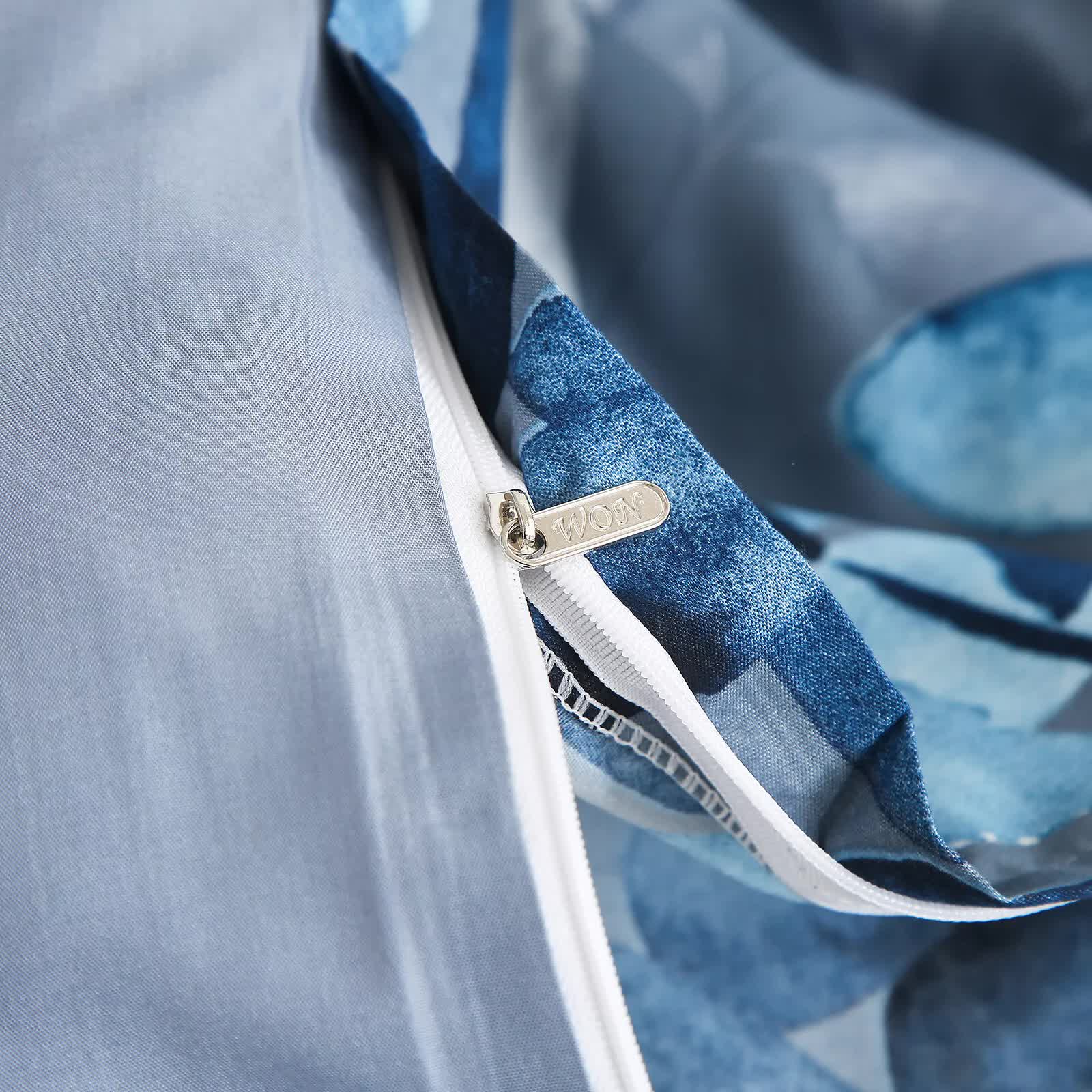 Close-up of zipper detail on Timeless Design Plaid Duvet Cover Set - Lightweight-Queen with blue and gray fabric layers