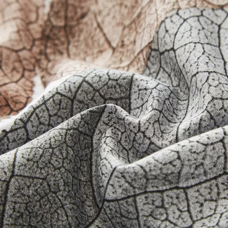 Close-up of textured fabric showcasing the Classic White Duvet Cover Set - Hotel-Quality Finish-King with soft leaf pattern details