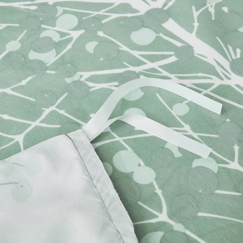 Close-up of Artistic Vibes Abstract Duvet Cover Set - Easy Maintenance-King showing tied corner straps and green abstract pattern