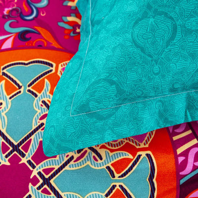 Close-up of vibrant floral patterned bedding with turquoise sham from Aesthetic Glow Floral 3‑Piece Comforter Set with Matching Shams