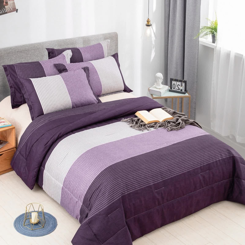 Urban Nest 3‑Piece Comforter Collection – Fresh Room Aesthetic with purple striped bedding on gray upholstered bed in bright bedroom