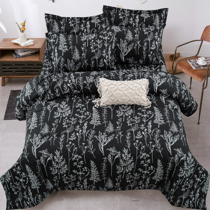 Floral Leaves Comforter Set, King Size, Microfiber Quilted Bedding with Pillowcase in black with white botanical print on bed.
