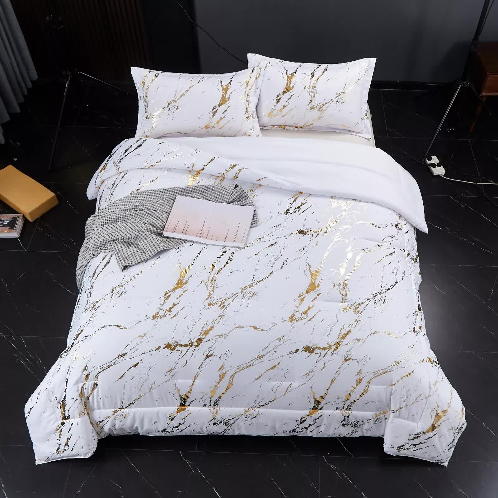 Cloud Rest Bedding Collection – Minimal 3‑Piece Comforter with white and gold marbled design on bed in modern bedroom setting
