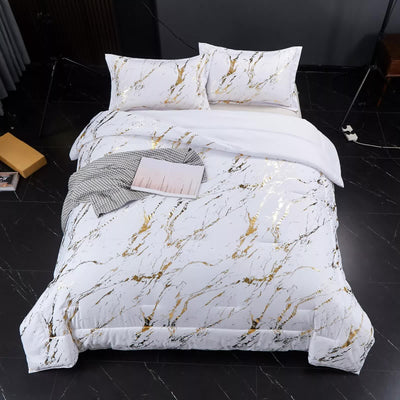 Cloud Rest Bedding Collection – Minimal 3‑Piece Comforter with white and gold marbled design on bed in modern bedroom setting