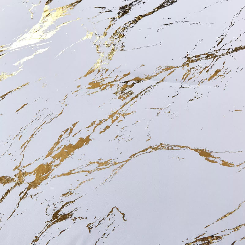 Close-up of gold marbled pattern on white fabric from Cloud Rest Bedding Collection – Minimal 3‑Piece Comforter.