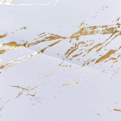 Close-up of gold marbled pattern on white fabric from Cloud Rest Bedding Collection – Minimal 3‑Piece Comforter