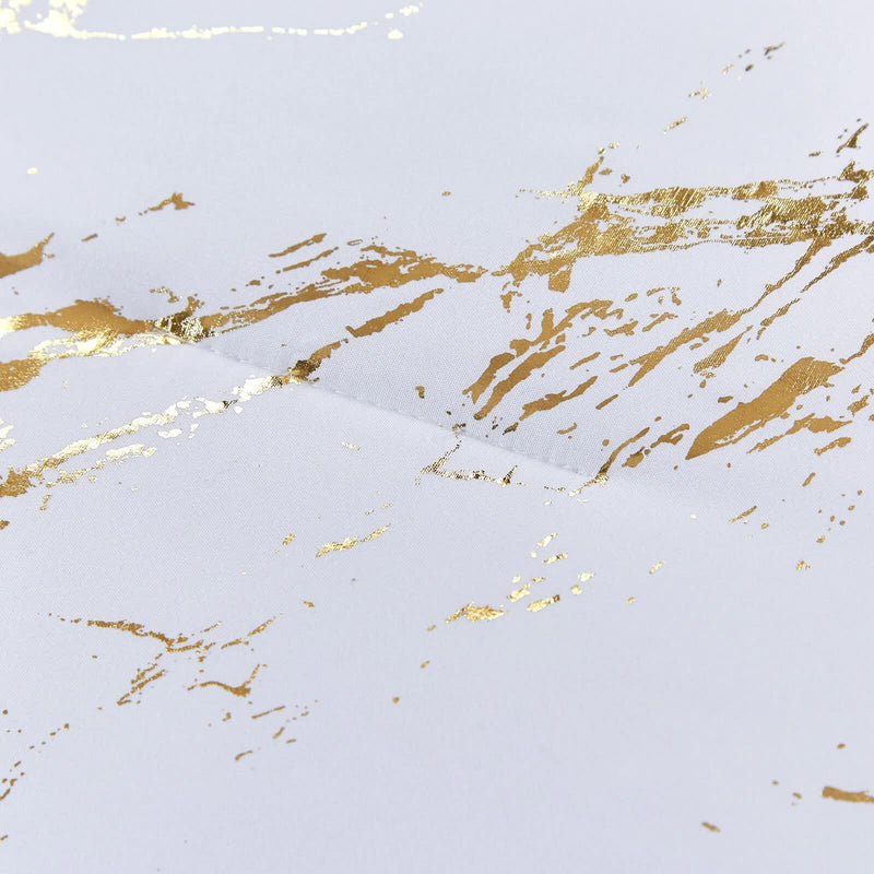 Close-up of gold marbled pattern on white fabric from Cloud Rest Bedding Collection – Minimal 3‑Piece Comforter