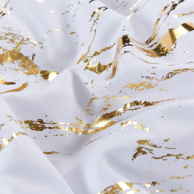 Close-up of white fabric with gold accents from Cloud Rest Bedding Collection – Minimal 3‑Piece Comforter set.