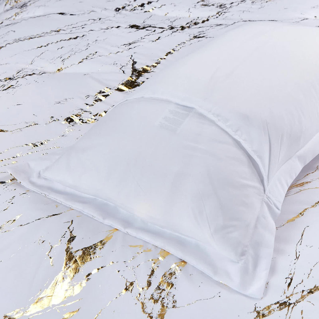 Cloud Rest Bedding Collection – Minimal 3‑Piece Comforter with white pillow and marble-patterned bed linen in bedroom setting