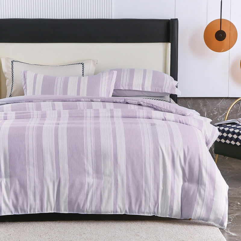 Midnight Calm stripes purple 3‑Piece Bedding – Cozy comforter Style with striped purple comforter and matching pillows on bed