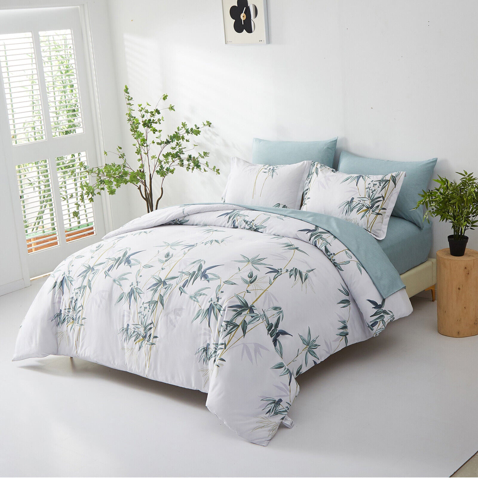 Floral Leaves Comforter Set, King Size, Quilted Bedding with Pillowcases on bed with blue pillows in bright bedroom