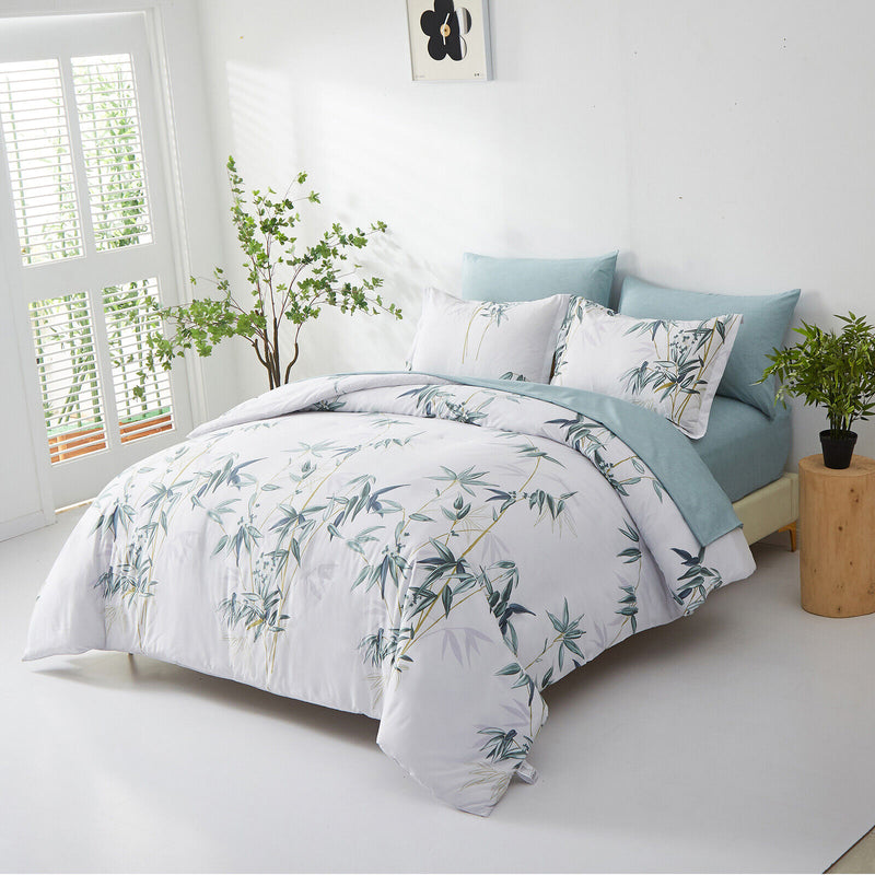 Floral Leaves Comforter Set, King Size, Quilted Bedding with Pillowcases on bed with blue pillows in bright bedroom