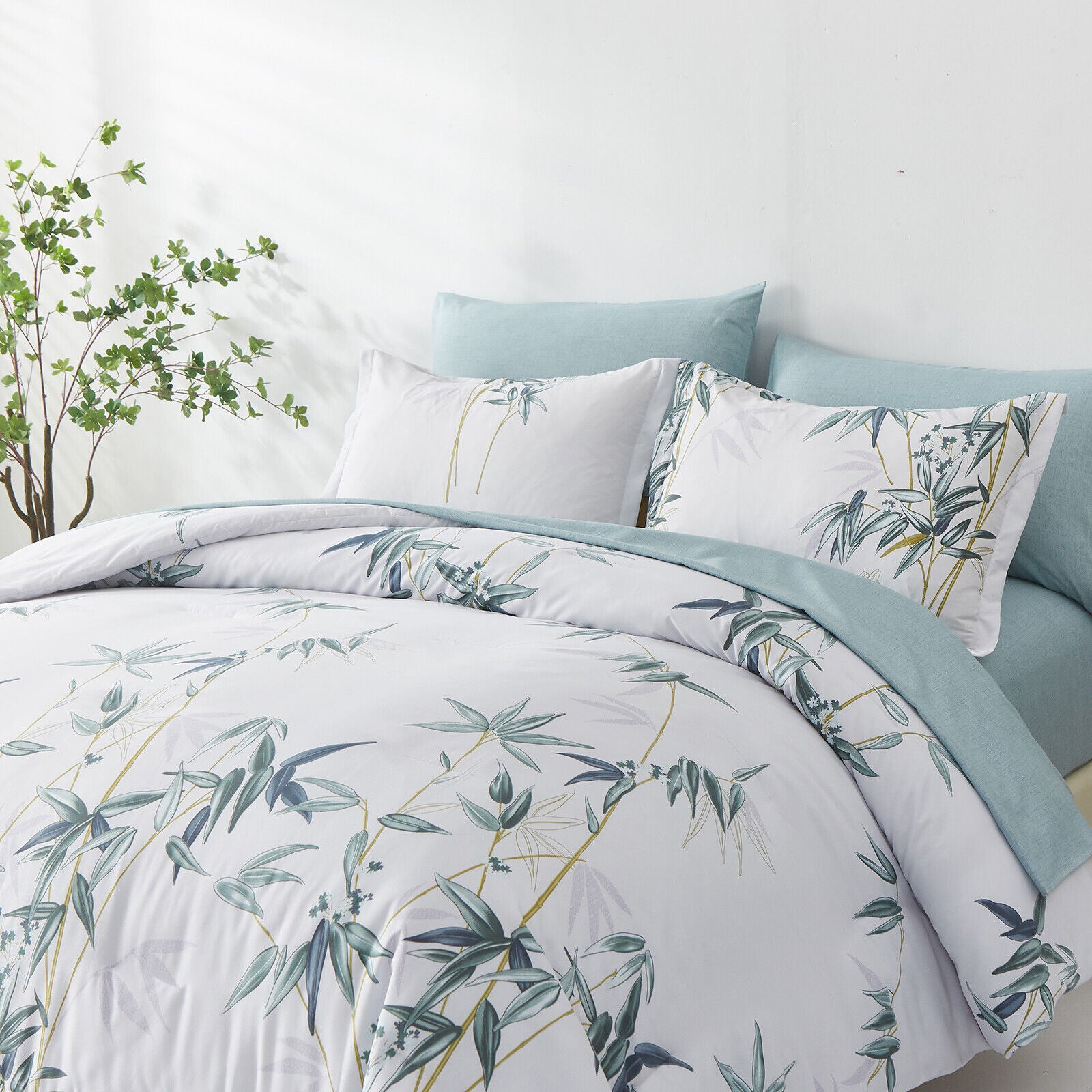Floral Leaves Comforter Set, King Size, Quilted Bedding with Pillowcases featuring botanical leaf print on light blue and white bed linens