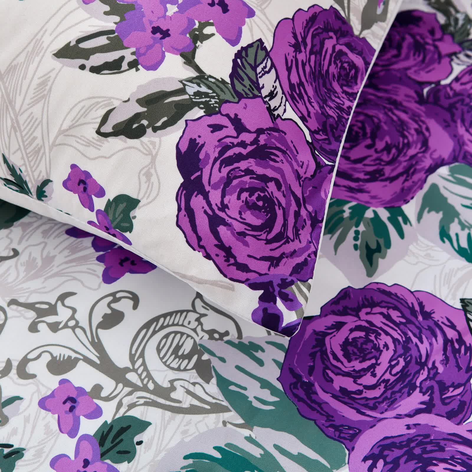 Close-up of Luxe Loft Purple rose Quilted Comforter & Shams – Trending 3‑Piece Set with purple floral pattern on white background