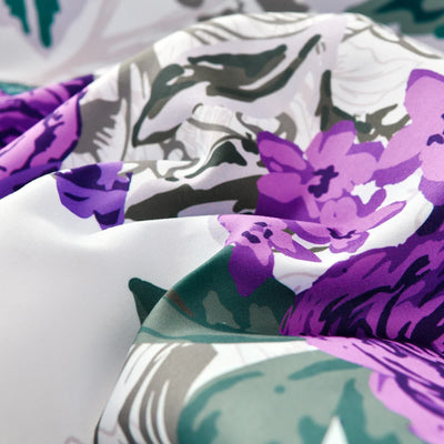 Close-up of Luxe Loft Purple rose Quilted Comforter & Shams – Trending 3‑Piece Set showcasing floral pattern and fabric texture.