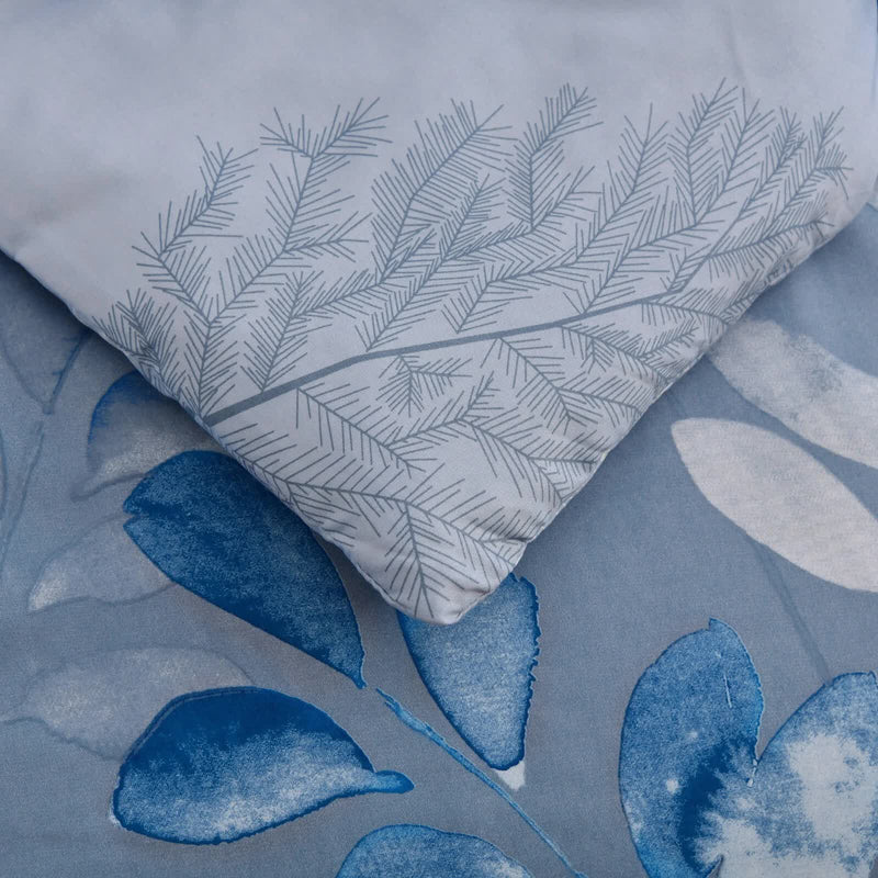 Close-up of blue and white floral patterns on GlowUp Bedroom Comforter – 3‑Piece Insta‑Aesthetic Set bedding pieces