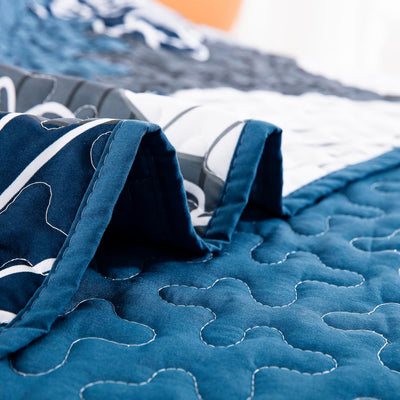 Close-up of Frosted Magnolia Chic blue 3 Pc Comforter & Pillow Cover Set KING showing quilted stitching and soft fabric texture
