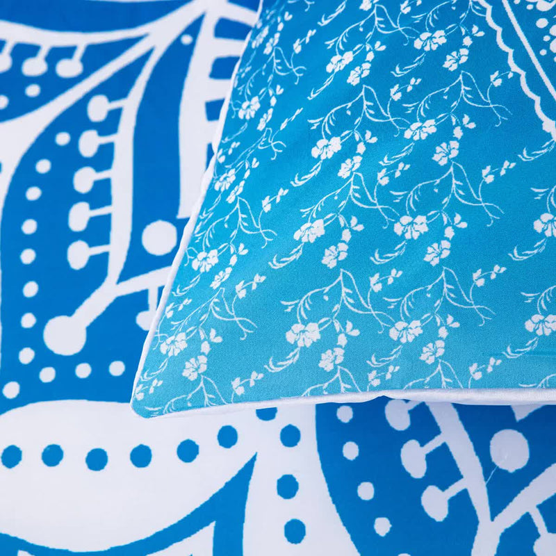 Close-up of blue and white floral pillow and patterned comforter from Dreamscape Sacred Circle Design Comforter Set – 3‑Pcs Refreshing