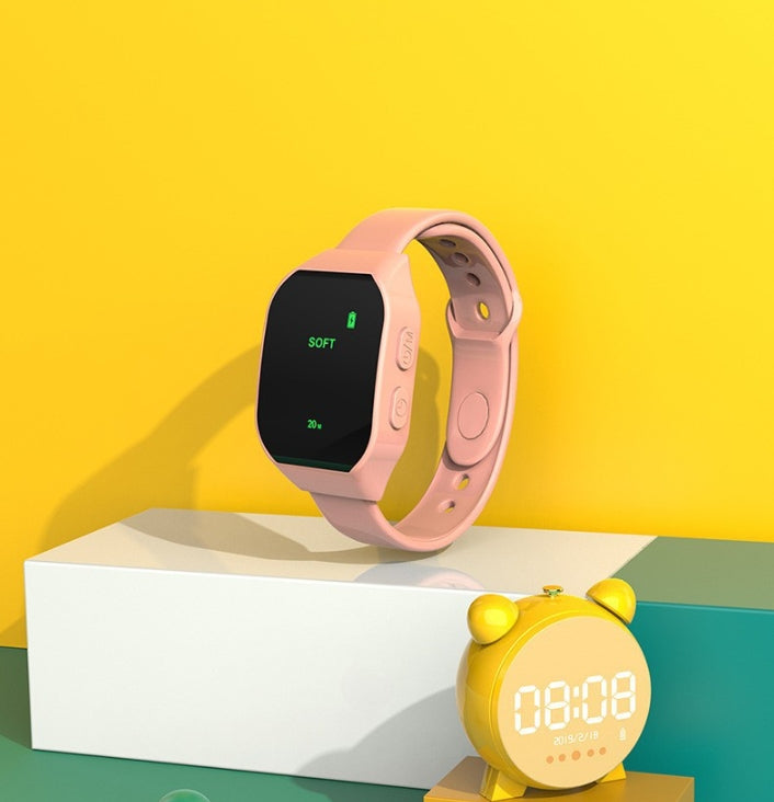 Pink Smart Microcurrent Wristband Sleep Aid - Wearable Sleep Assistance Device displayed with yellow digital alarm clock on yellow background