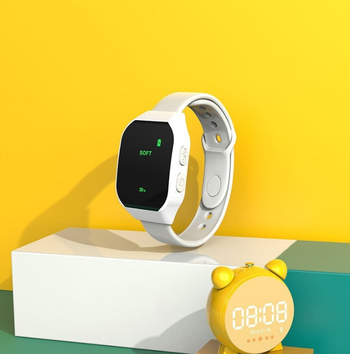 White Smart Microcurrent Wristband Sleep Aid - Wearable Sleep Assistance Device displayed on white platform with yellow alarm clock
