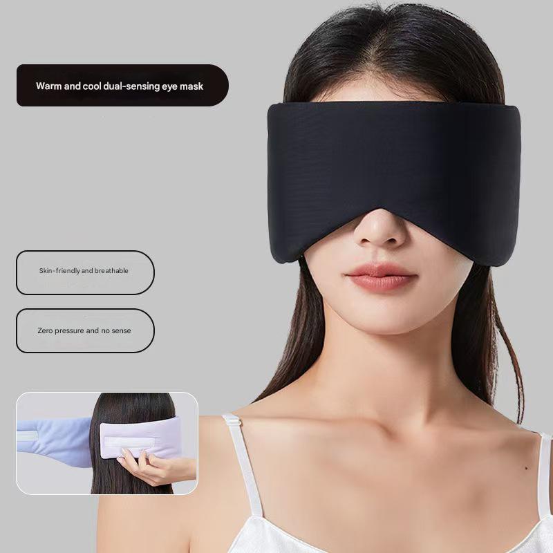 Black Reversible All-Season Sleep Mask - Cooling & Warming with Sound Muffling Ear Covers Function worn by model on gray background