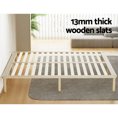 Amba Minimalist King Wooden Bed Frame Pine with 13mm thick wooden slats on a gray rug in modern bedroom setting