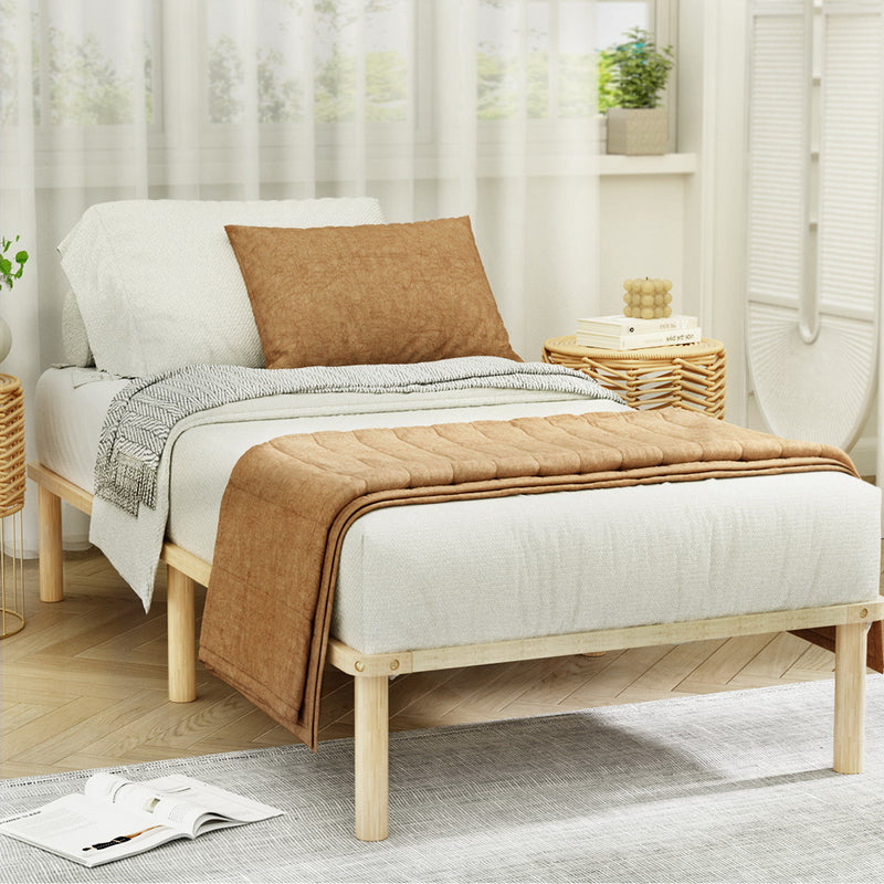 Amba Minimalist King Single Wooden Bed Frame Pine with natural pinewood finish in a bright, styled bedroom setting