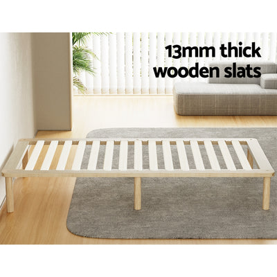 Amba Minimalist Single Wooden Bed Frame Pine with 13mm thick wooden slats on a gray rug in bright room