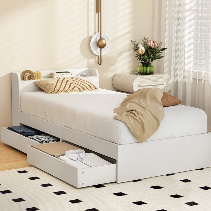 Aura Single Bed Frame With 2 Storage Drawers White in a bedroom setting with pillows, beige throw, and decorative accents.